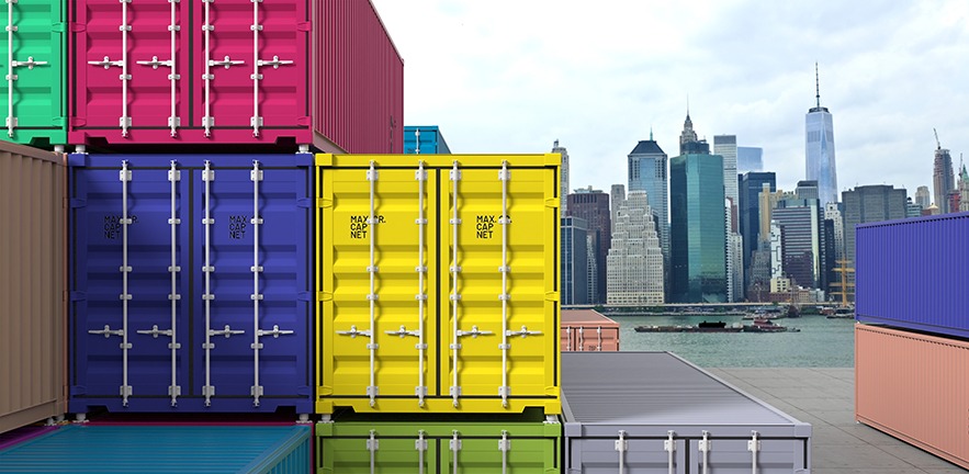 Cargo containers with the New York skyline in the background.