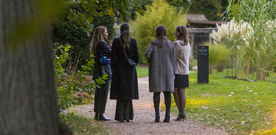 Four female MBA students outside.