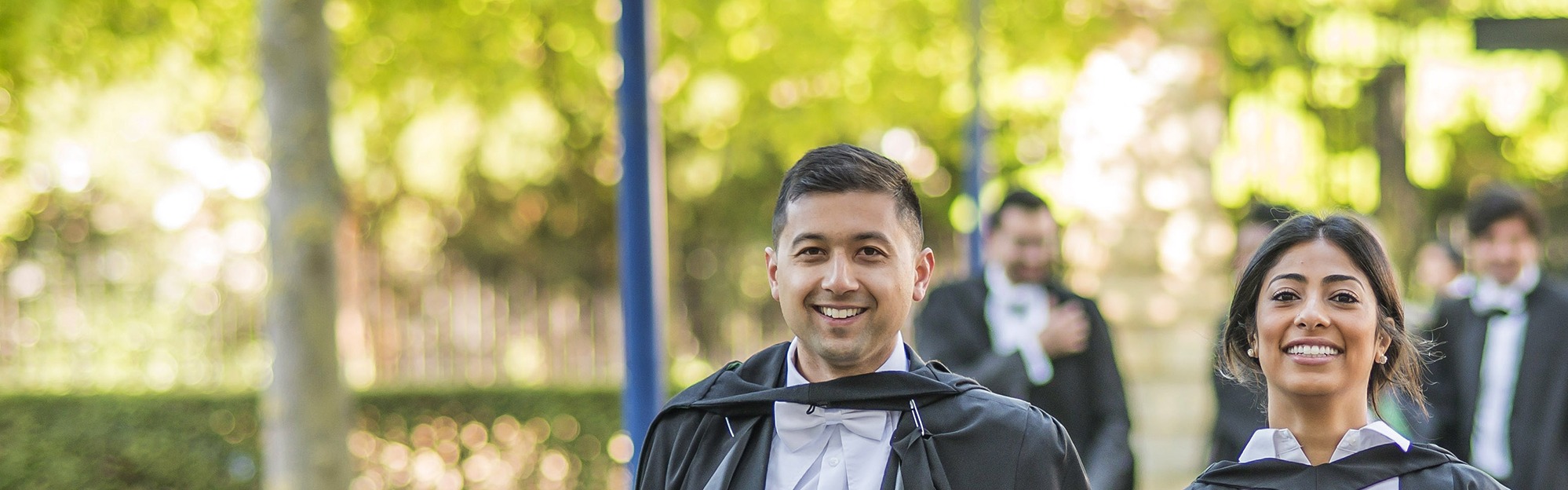 Two graduating MBA students.
