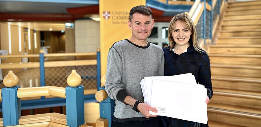 Andrei Kirilenko and Kate Shcheglova-Goldfinch of the NBU holding the CJBS Executive Education certificates of participants.