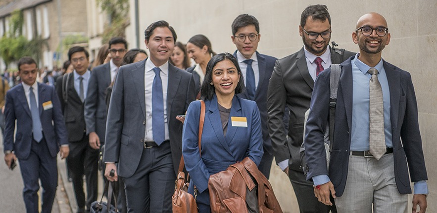 Group of MBA students walking through Cambridge.