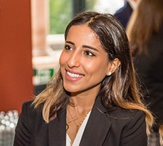 Smiling female MBA student in the CJBS building.