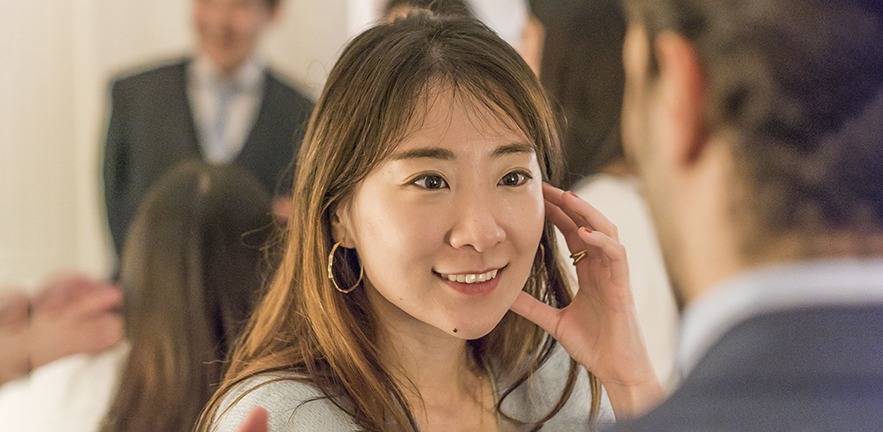 Close up of a young professional woman taling.