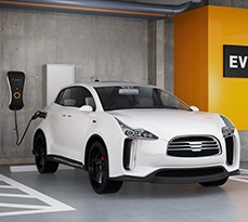 White electric SUV recharging in parking garage.