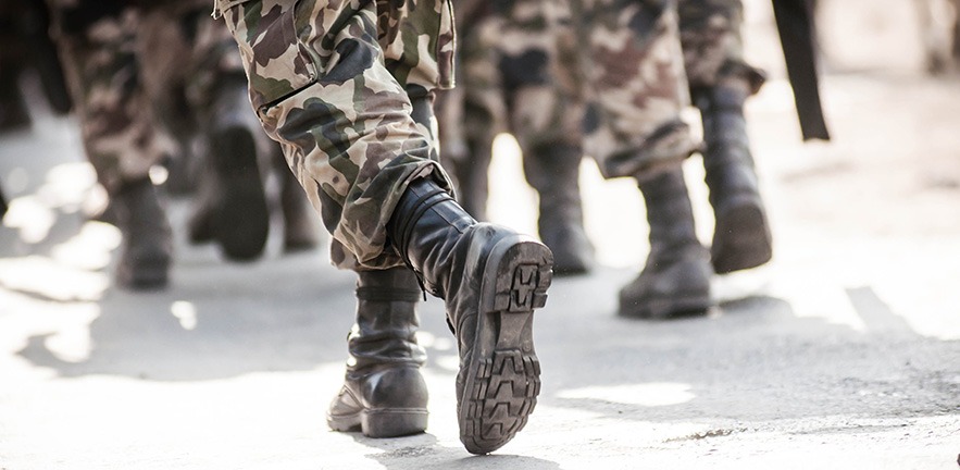 Running soldiers carrying weapons.