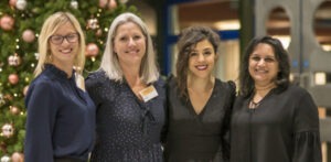 Four women attending an EnterpriseWOMEN event.