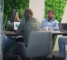 Group of business people are having a business meeting in a meeting room in a modern office working space.
