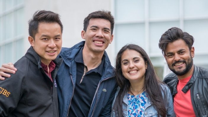 Smiling MBA students.