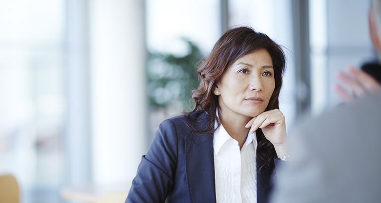 Woman listening during a meeting.