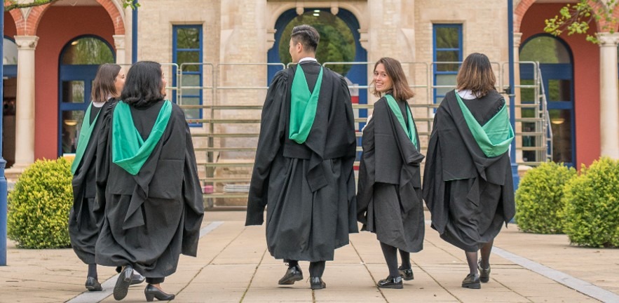 MBA students outside Cambridge Judge Business School.