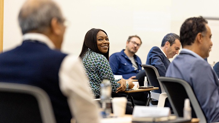 Woman smiling in classroom.