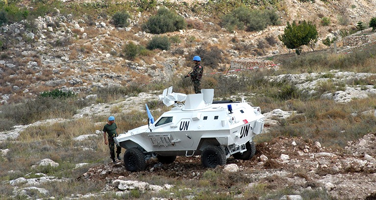 United Nations vehicle with soldiers.