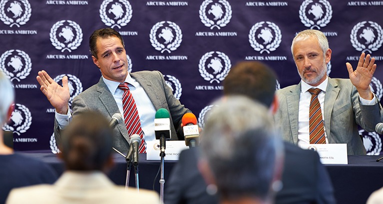 Shot of a group of businesspeople in a press conference.