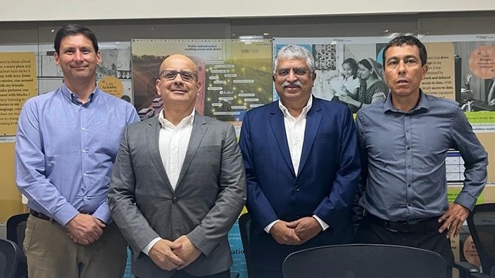 Nandan Nilekani and Carlos Montes with colleagues.