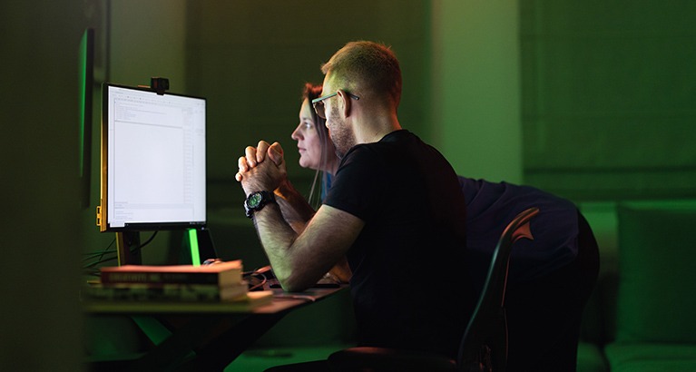 People looking at a computer screen.