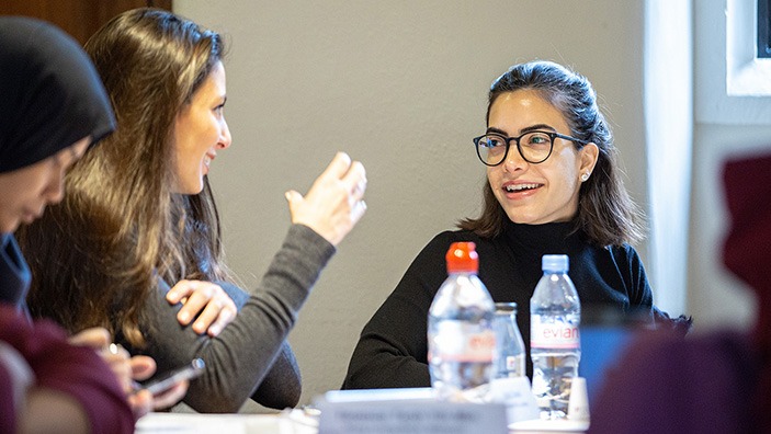 Two women chatting.