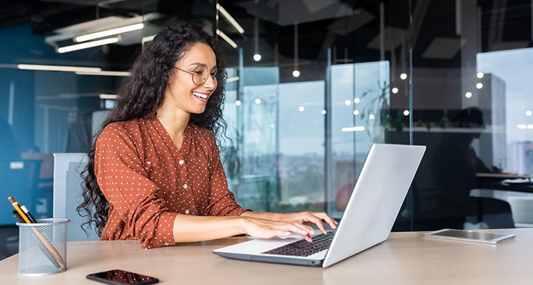 Social entrepreneur using a laptop.