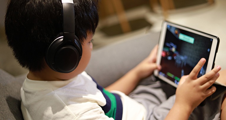 Child using a digital tablet.