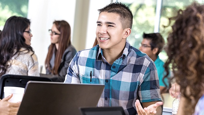 Students with laptops.