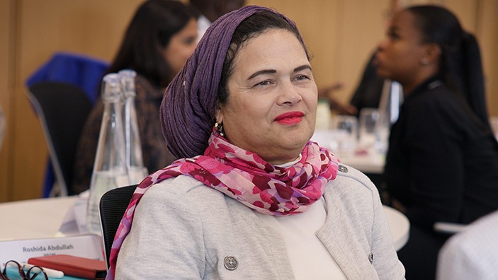 Participant listening attentively during a Cambridge Judge Business School women’s leadership session.
