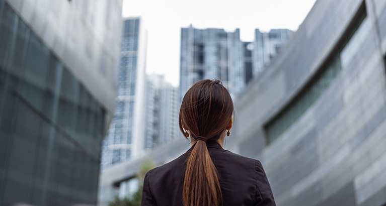 Woman looking up at the local environment.