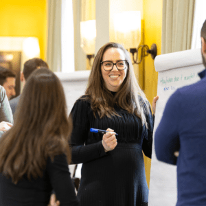 Delegates taking notes on a flipchart