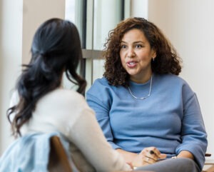 Woman giving mentoring to another woman.
