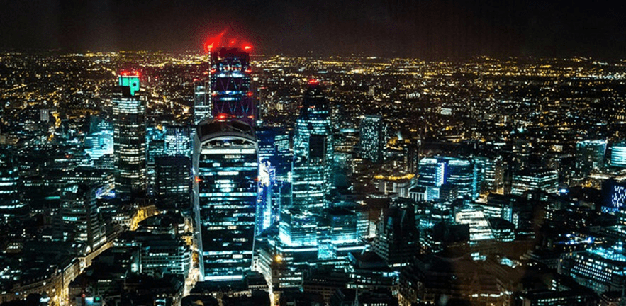 City of London illuminated at night.
