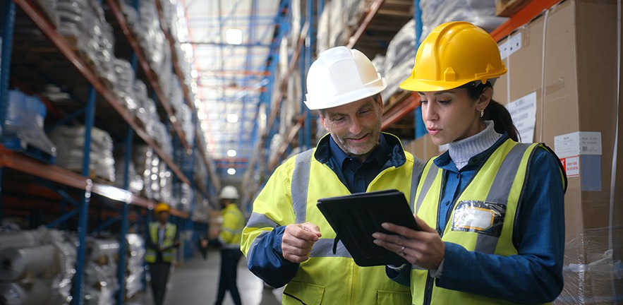 Quality control, woman and man in warehouse with tablet, coordination and distribution. Logistics, manager and digital checklist in storage facility with delivery, export or shipping in supply chain.