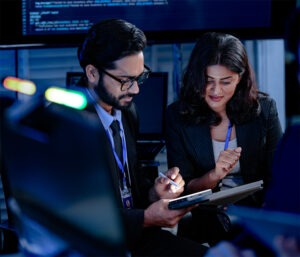 Two colleagues working together in a AI lab.