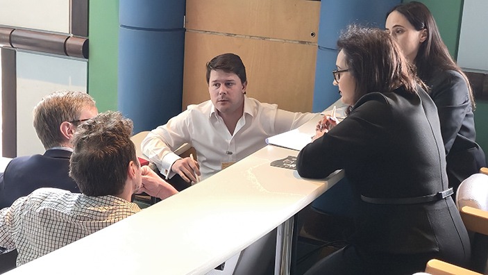 Group of EMBAs in discussion.