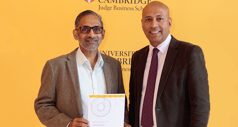 Professor Paul Kattuman receives a Teaching Award from Dean Gishan Dissanaike.