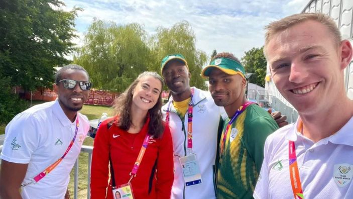 Jason Sewanyana at the Commonwealth Games with athletes.
