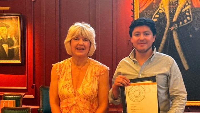 Andres holding a certificate next to a woman at Ignite 2026.