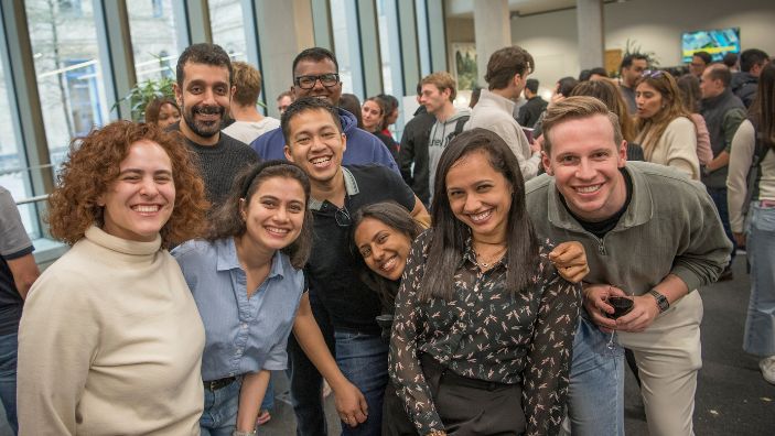 MBA students in a group smiling