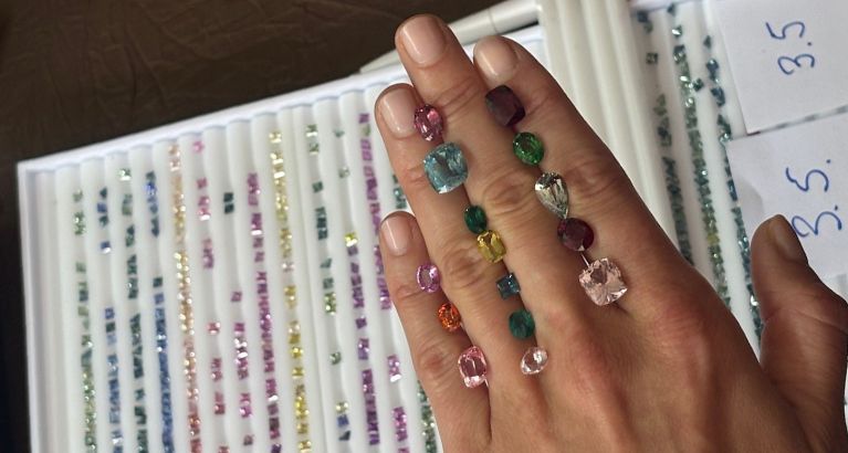 Hand holding gemstones.