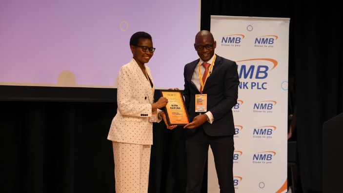 Ruth Zaipuna getting awarded something on stage at CABN.