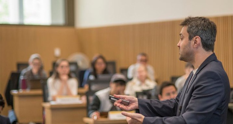 Lecturer addressing students.